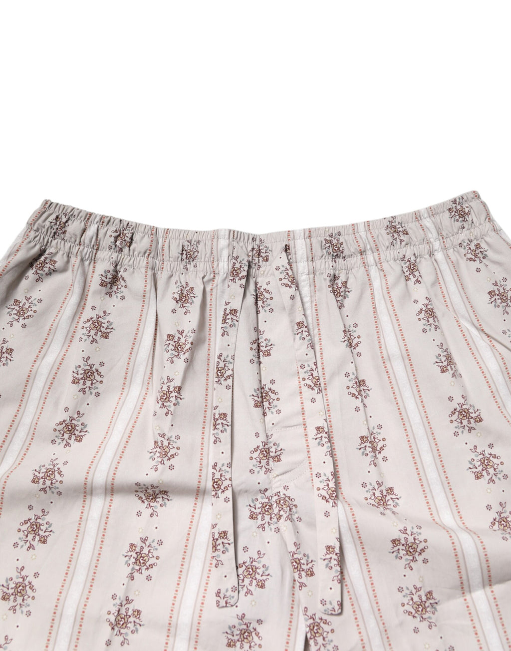 Pyjama homme Dolce & Gabbana en coton beige avec imprimé floral, ensemble de sommeil élégant et confortable.