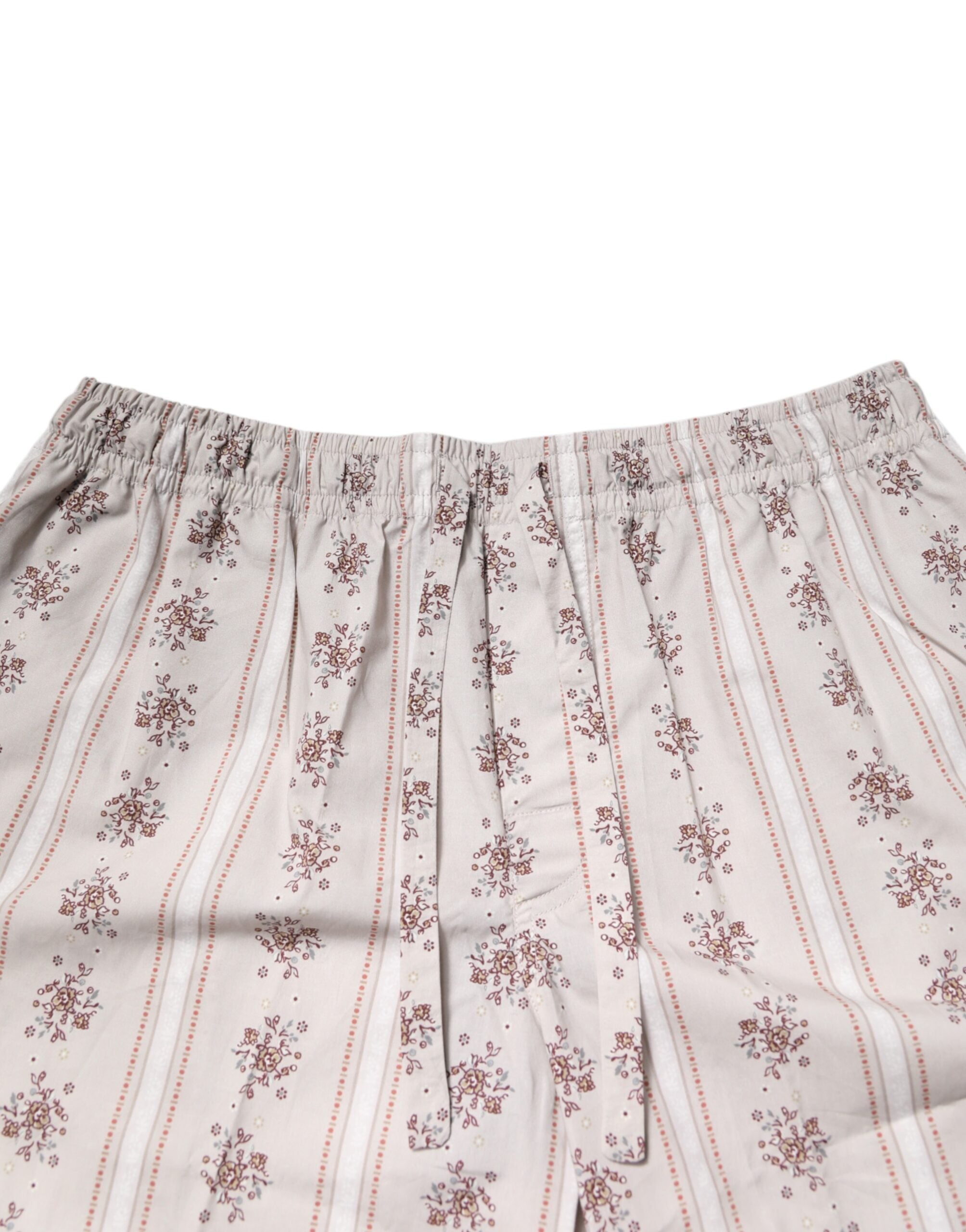Pyjama homme Dolce & Gabbana en coton beige avec imprimé floral, ensemble de sommeil élégant et confortable.