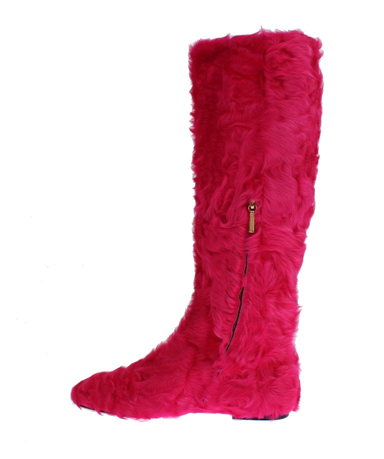 Bottes plates en cuir rose avec fourrure de mouton Dolce & Gabbana, style élégant et confortable pour femmes.