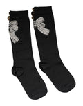 Chaussettes noires en tricot Dolce & Gabbana avec fleurs brodées et embellissements en cristal, détails élégants.