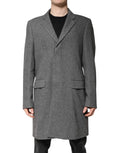 Manteau trench en laine gris à un seul boutonnage de Dolce & Gabbana, veste élégante avec ceinture et col classique.