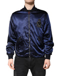 Veste bomber en nylon bleu Dolce & Gabbana avec fermeture éclair pleine, logo DG et motif couronne.