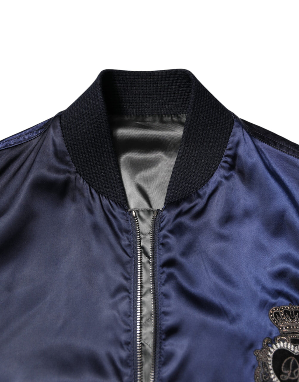 Veste bomber bleue en nylon Dolce & Gabbana avec fermeture éclair et logo DG en forme de couronne.