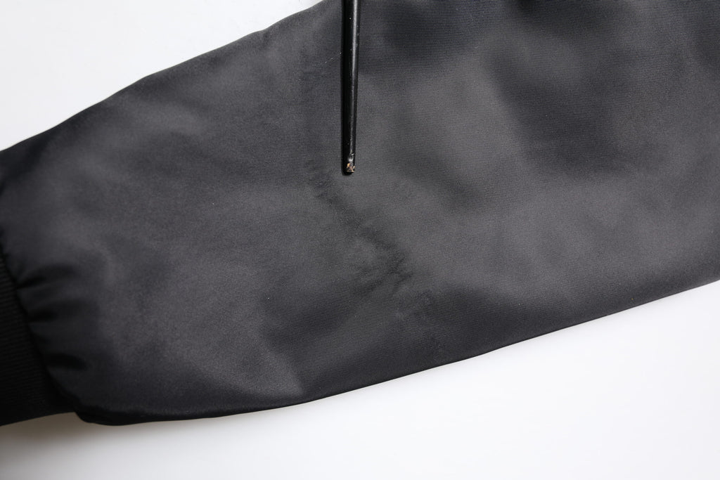 Veste noire en cuir d'agneau de style motard Dolce & Gabbana avec fermeture éclair complète, détails robustes et design élégant.