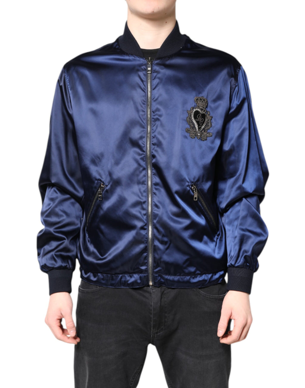 Veste bomber bleue en nylon Dolce & Gabbana avec fermeture éclair pleine, logo DG et motif couronne sur le devant.