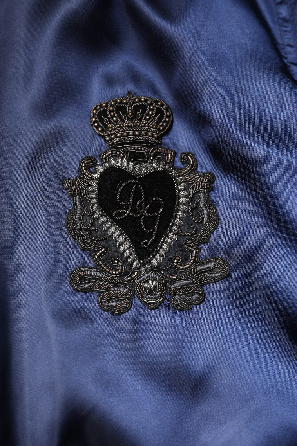 Veste bomber en nylon bleu Dolce & Gabbana DG Crown avec fermeture éclair complète, style élégant et moderne.