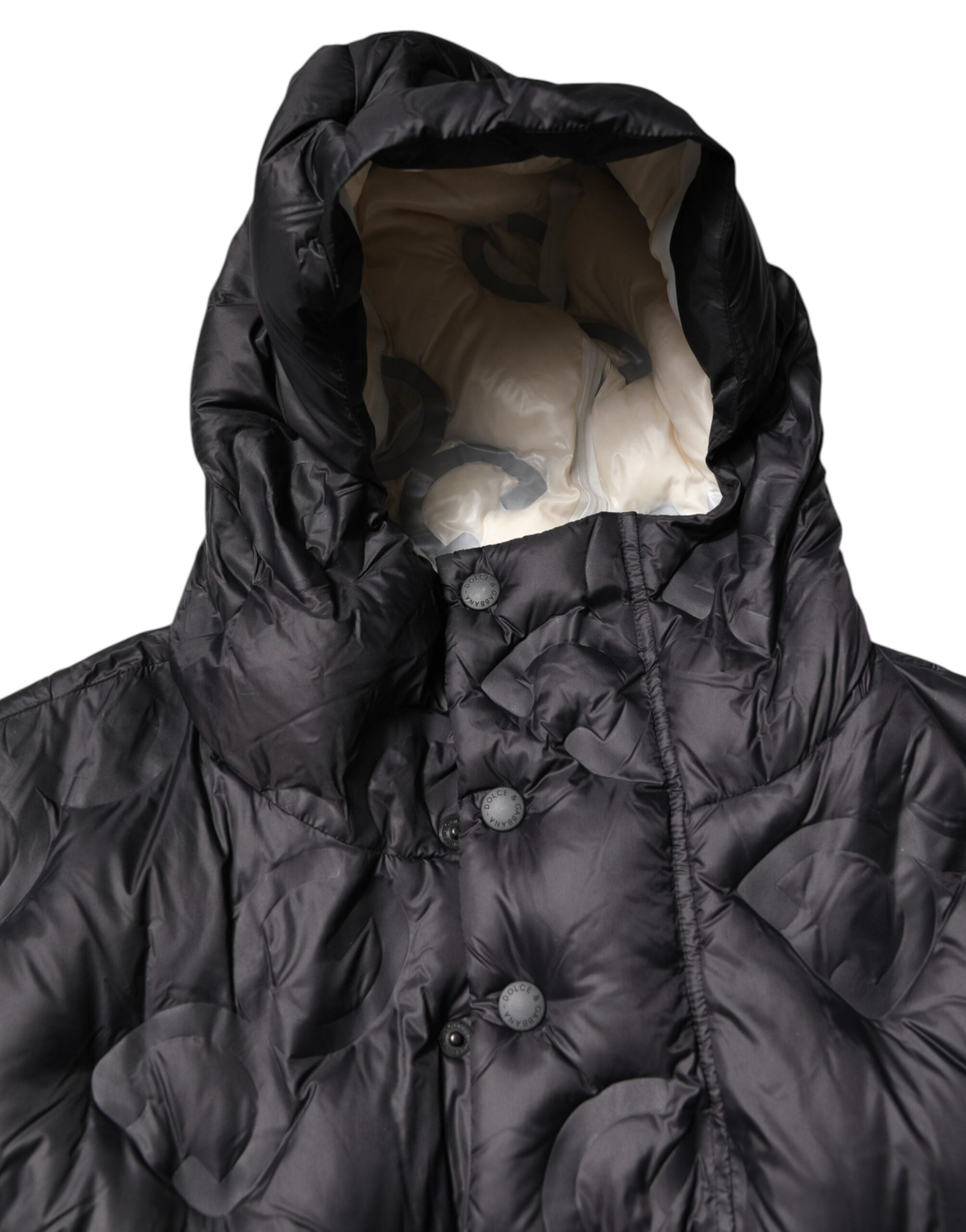 Veste d'hiver noire Dolce & Gabbana parka à capuche, coupe décontractée, idéale pour la saison froide, avec détails élégants.