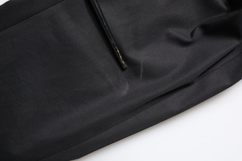Manteau pour homme Dolce & Gabbana en coton noir avec un style blazer à simple boutonnage, vue de face sur fond blanc.