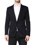 Manteau blazer noir en laine Dolce & Gabbana, coupe simple boutonnière, porté sur un mannequin.