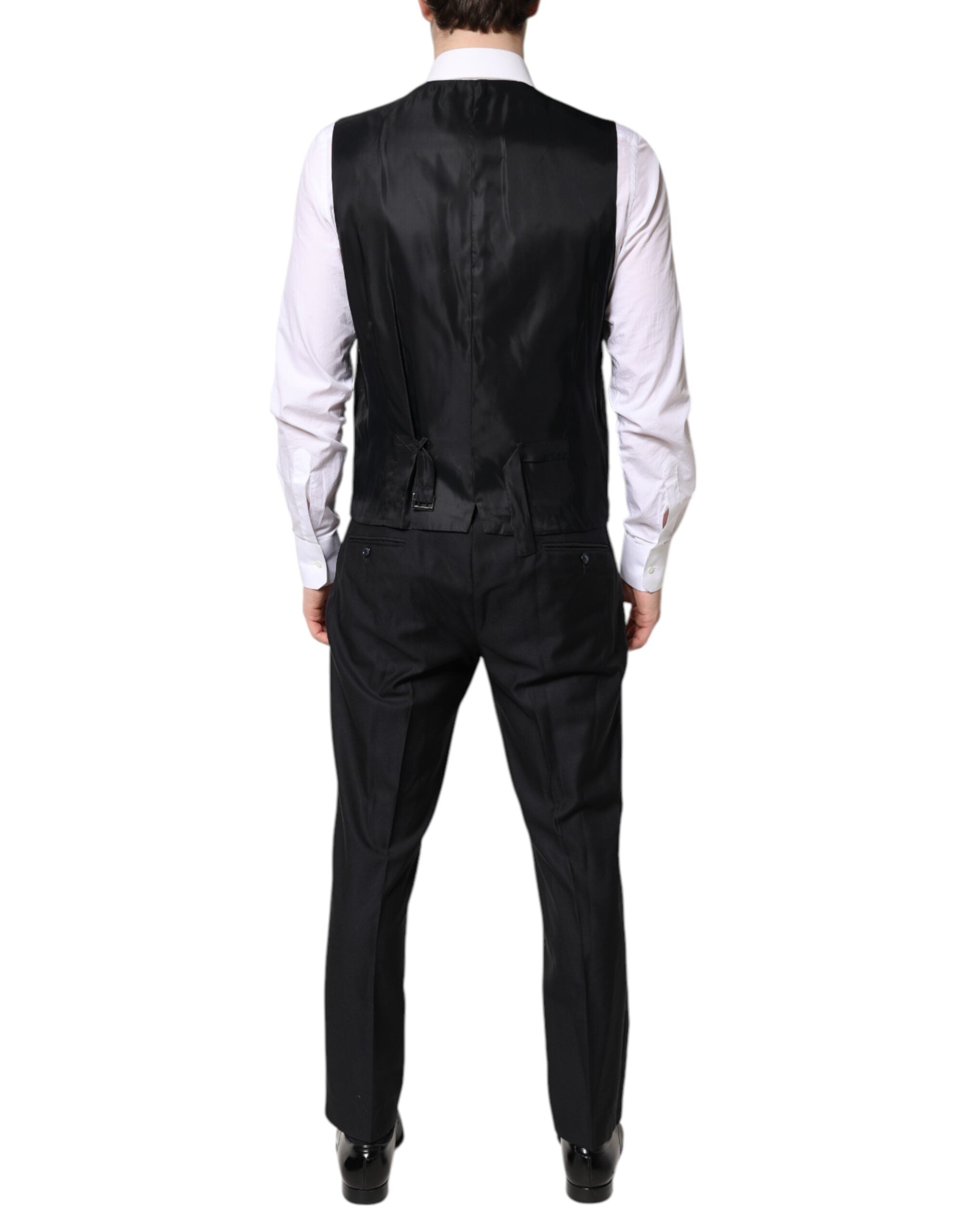 Costume formel noir Dolce & Gabbana à trois pièces avec double boutonnage, veste, pantalon et gilet élégants.