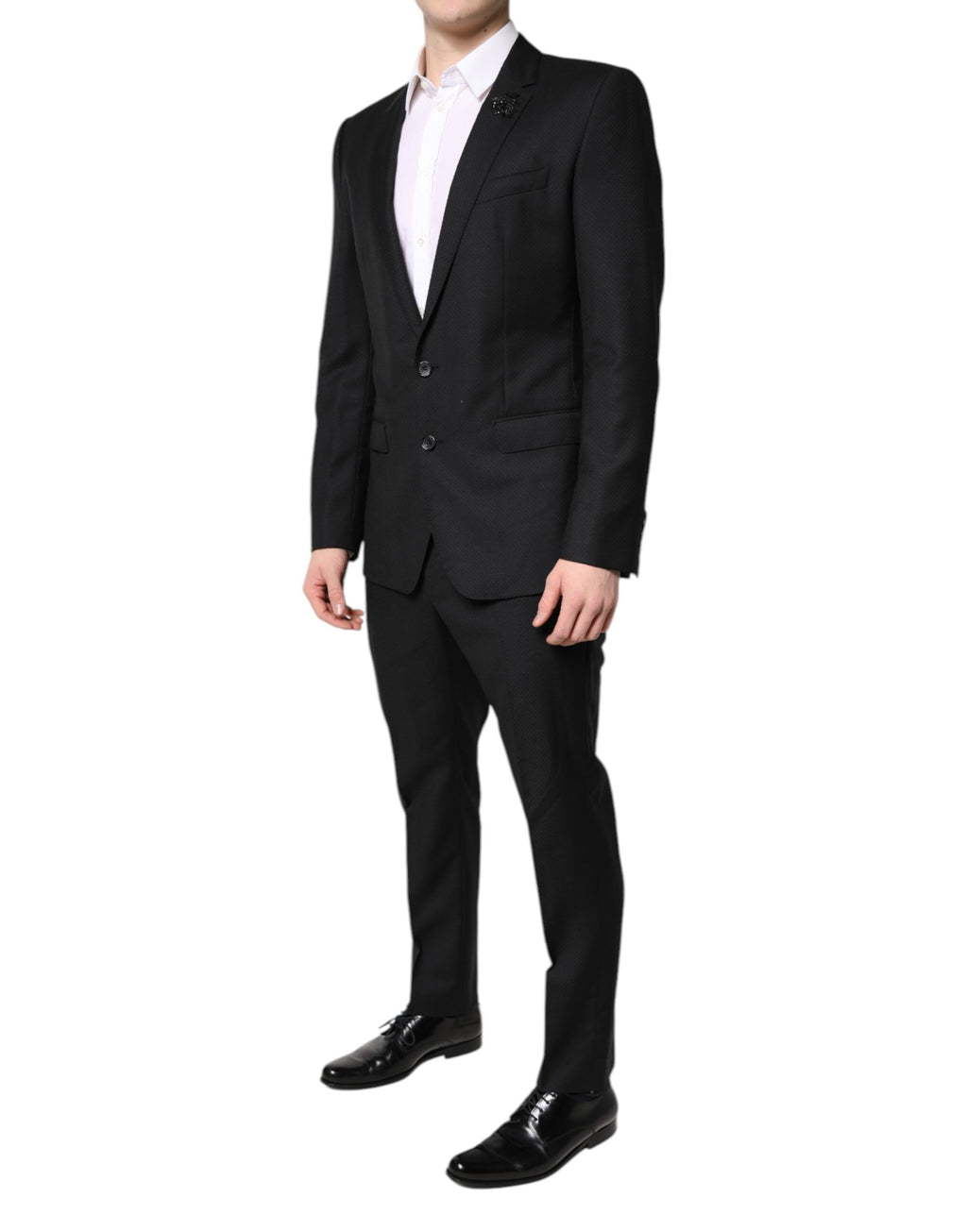 Costume deux pièces en laine noire Dolce & Gabbana, veste croisée à un bouton et pantalon assorti, élégant et sophistiqué.