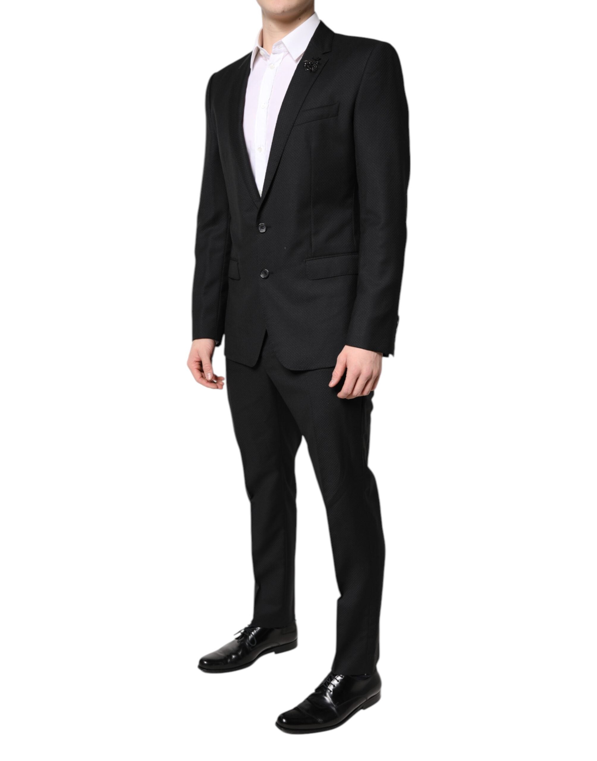 Costume deux pièces en laine noire Dolce & Gabbana, veste croisée à un bouton et pantalon assorti, élégant et sophistiqué.