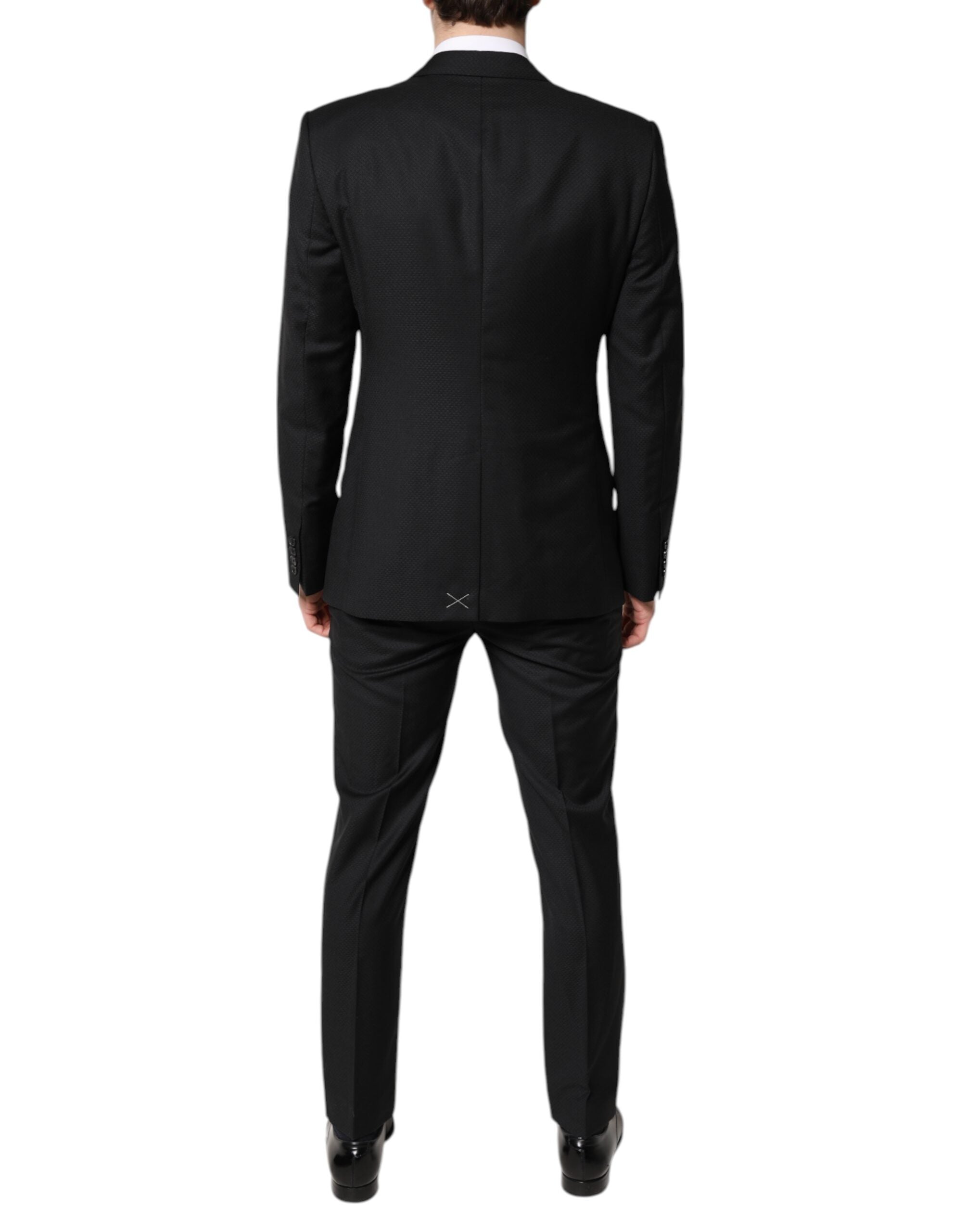 Costume homme Dolce & Gabbana en laine noire à deux pièces, veste croisée simple boutonnage et pantalon assorti.