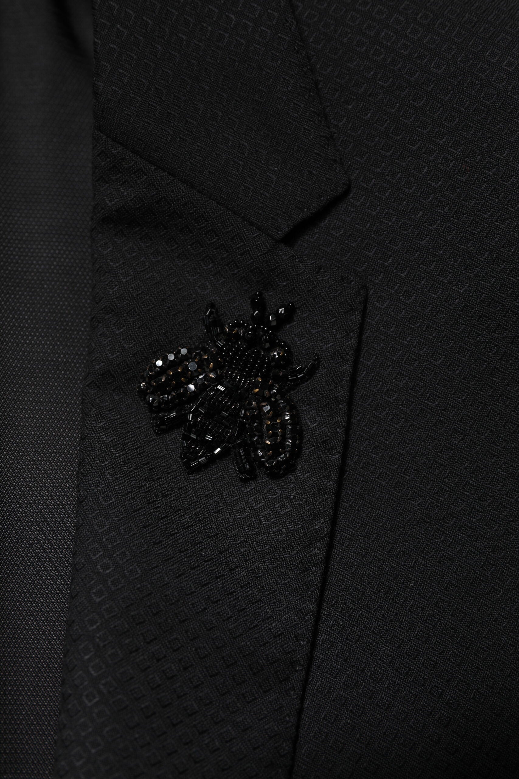 Costume deux pièces en laine noire Dolce & Gabbana, veste à double boutonnage et pantalon assorti, élégant et classique.