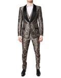 Costume trois pièces Dolce & Gabbana en jacquard multicolore, avec veste à double boutonnage et pantalon assorti.