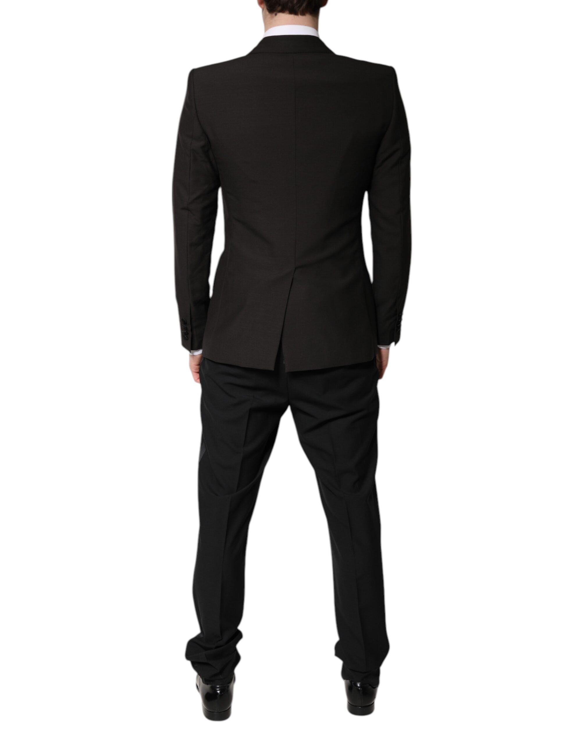 Costume formel trois pièces Dolce & Gabbana noir, veste croisée à boutonnière simple, pantalon et gilet assortis.