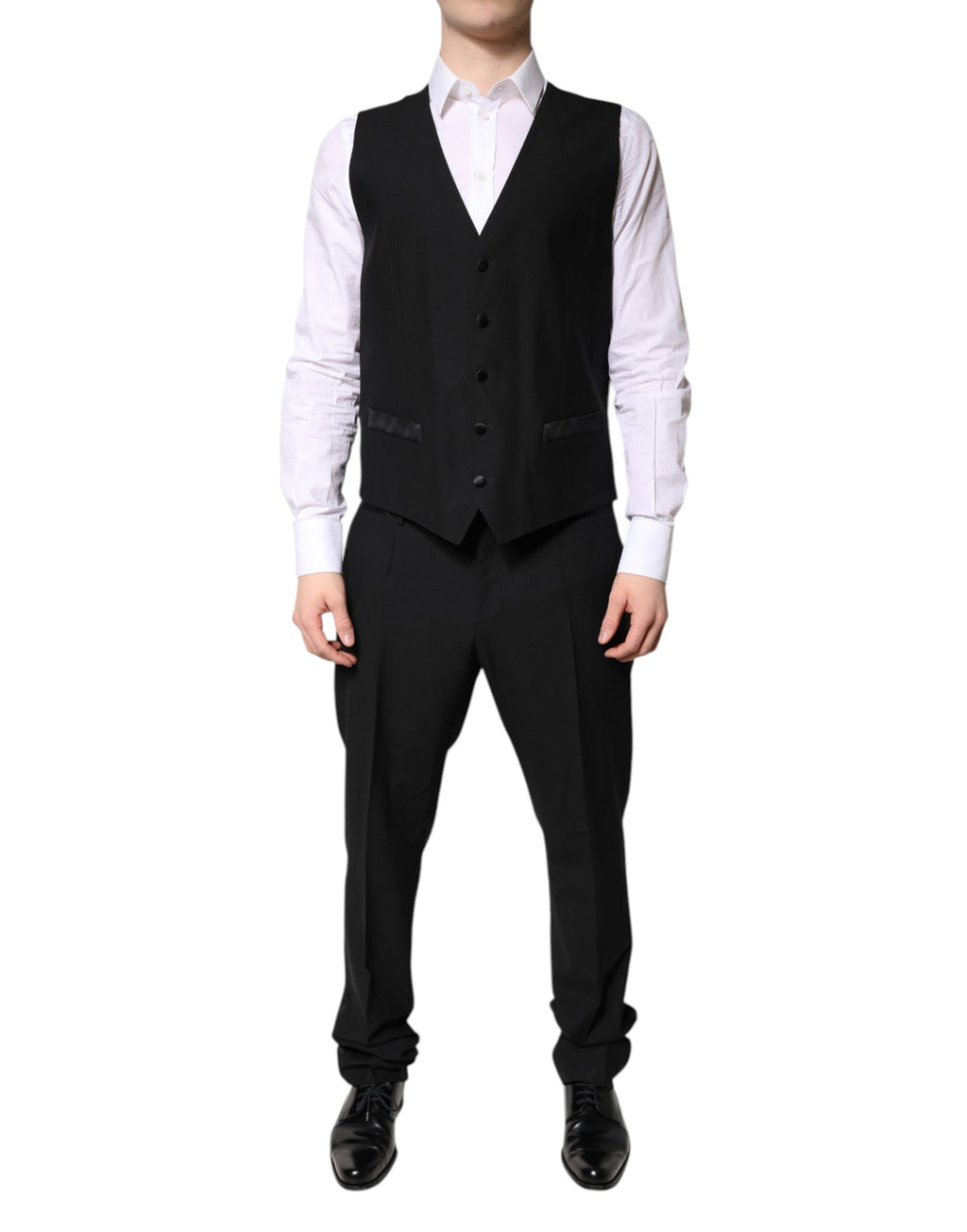 Costume formel noir à trois pièces Dolce & Gabbana, veste à un bouton, pantalon et gilet élégants, pour occasion spéciale.