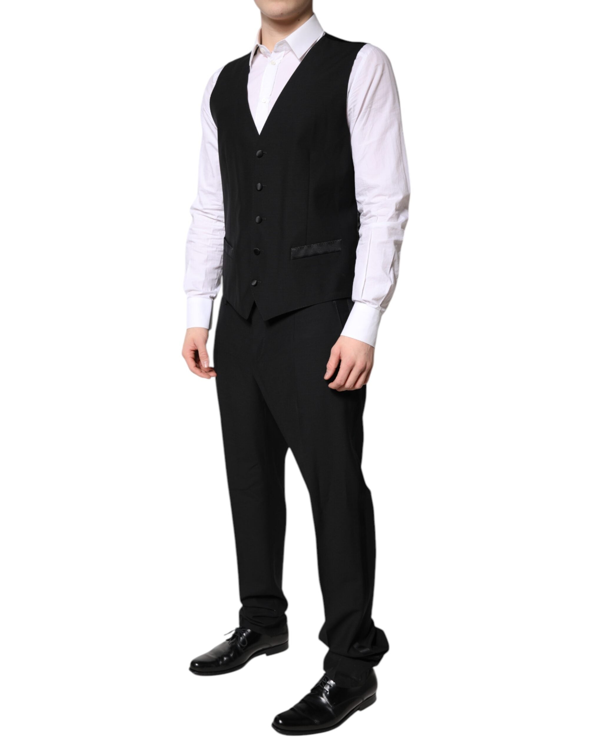 Costume formel noir Dolce & Gabbana en 3 pièces, veste à un seul bouton, pantalon et gilet élégants pour homme.