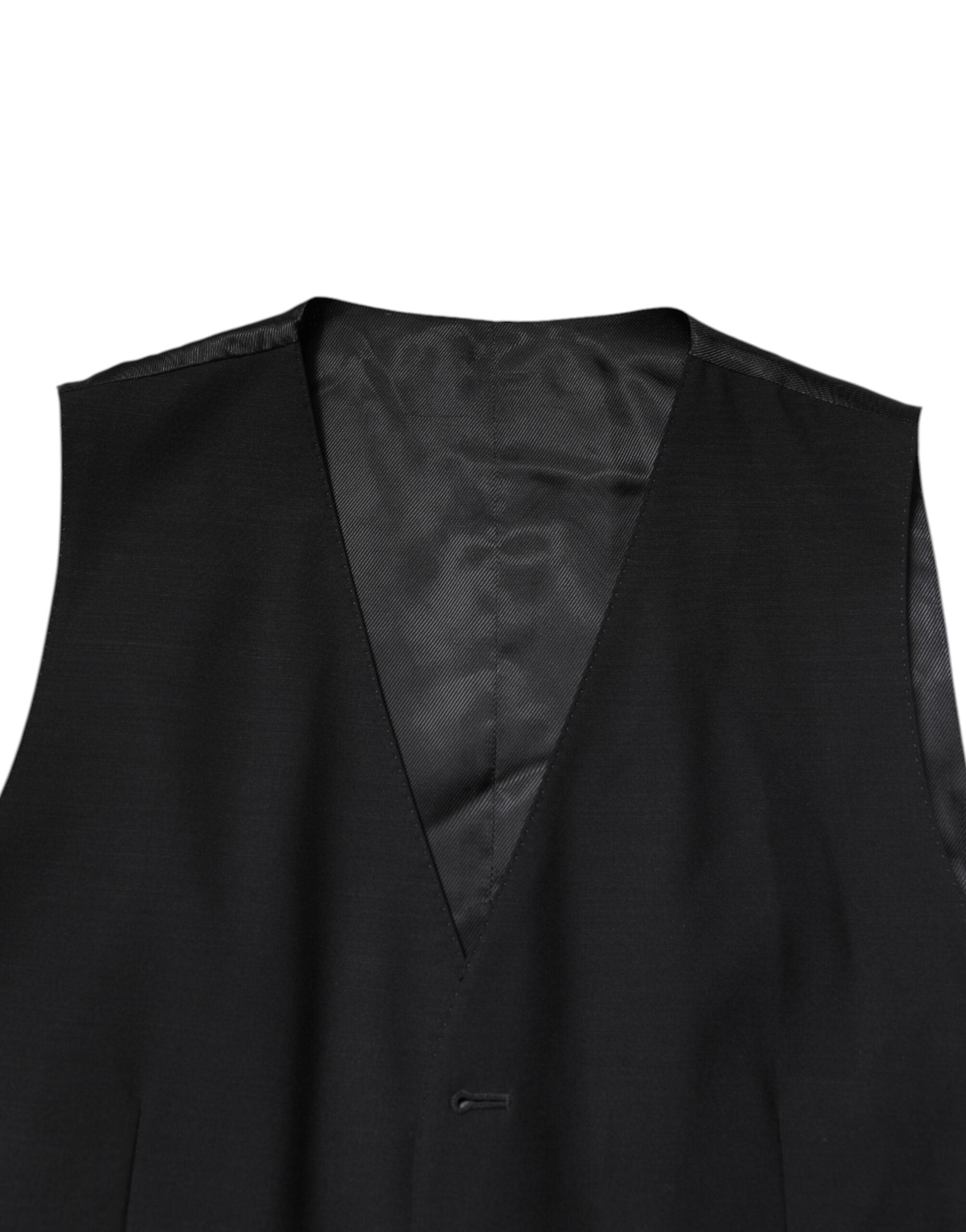 Costume formel noir Dolce & Gabbana à trois pièces, veste croisée simple boutonnage, pantalon et gilet élégants.