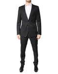 Costume en laine gris foncé Dolce & Gabbana, costume deux pièces à revers simples, vue détaillée du blazer et du pantalon.