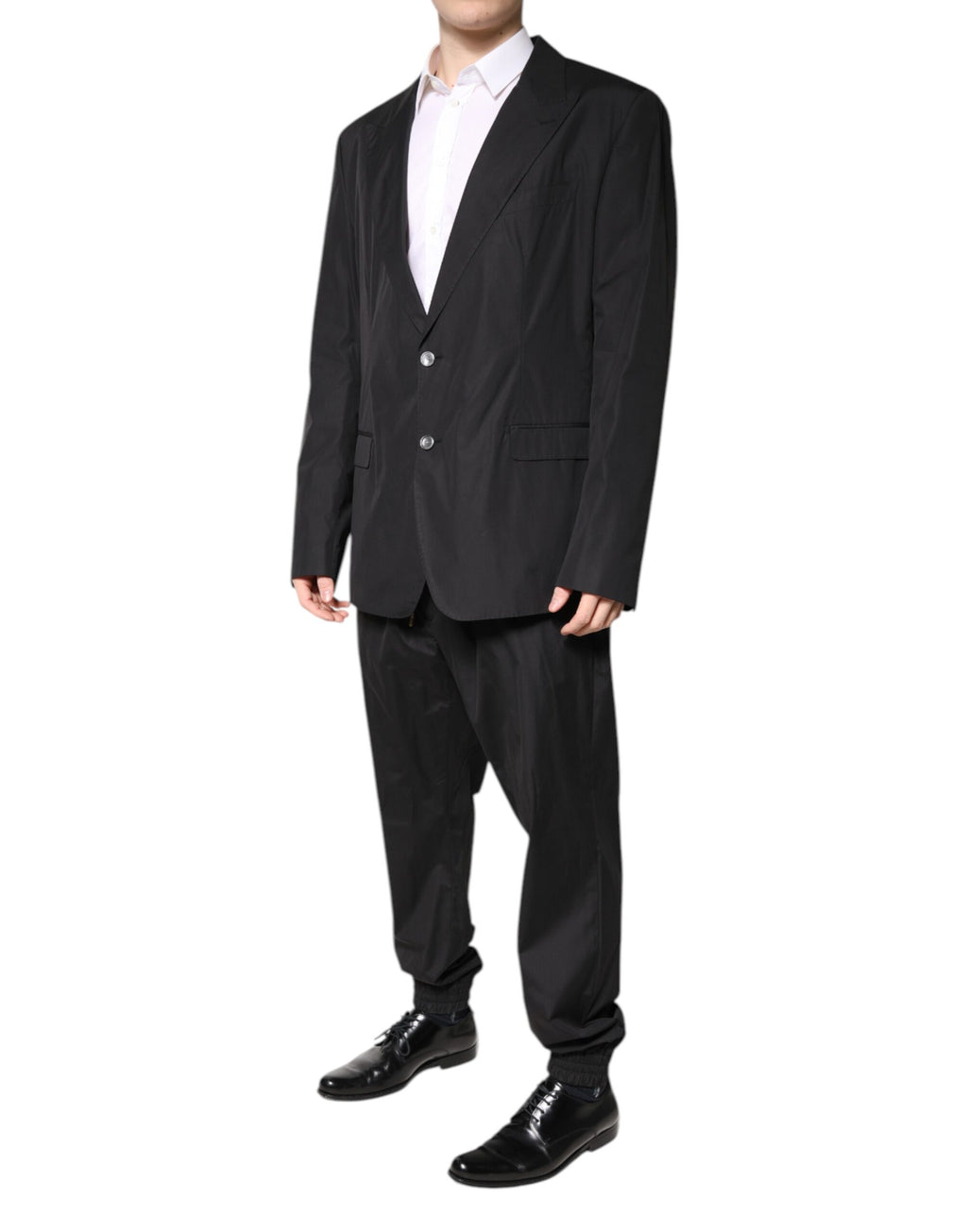 Costume deux pièces noir en coton de Dolce & Gabbana, veste à boutons simple breasted et pantalon assorti, élégant et moderne.