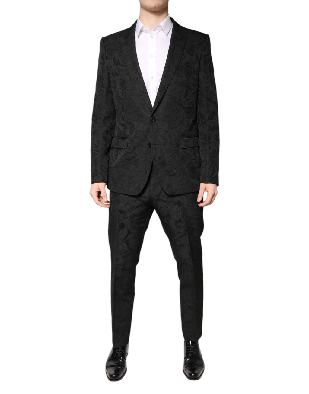 Costume deux pièces en polyester noir Dolce & Gabbana avec jacquard floral, veste et pantalon élégants, sur mannequin.