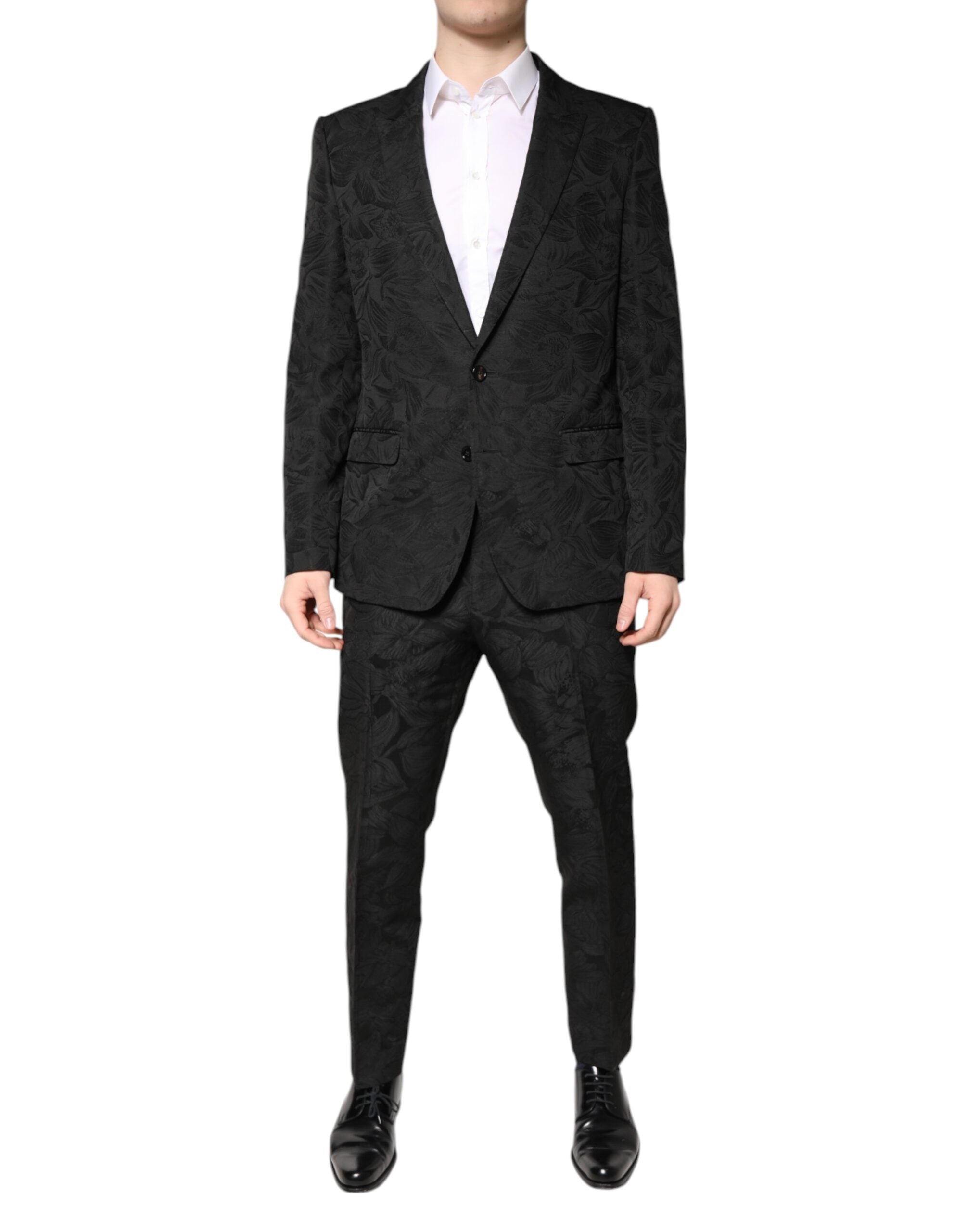 Costume deux pièces en polyester noir Dolce & Gabbana avec jacquard floral, veste et pantalon élégants, sur mannequin.