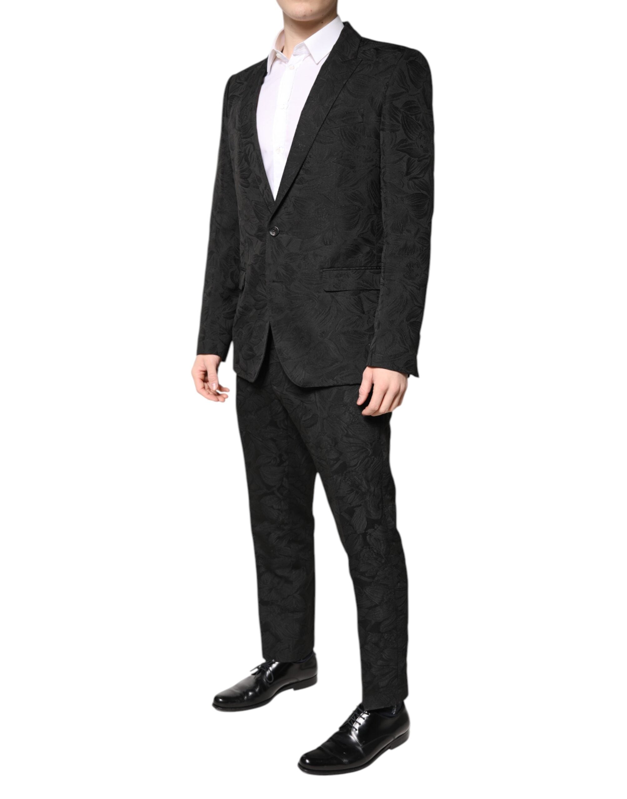 Costume deux pièces en polyester noir avec jacquard floral de Dolce & Gabbana, veste et pantalon élégants.