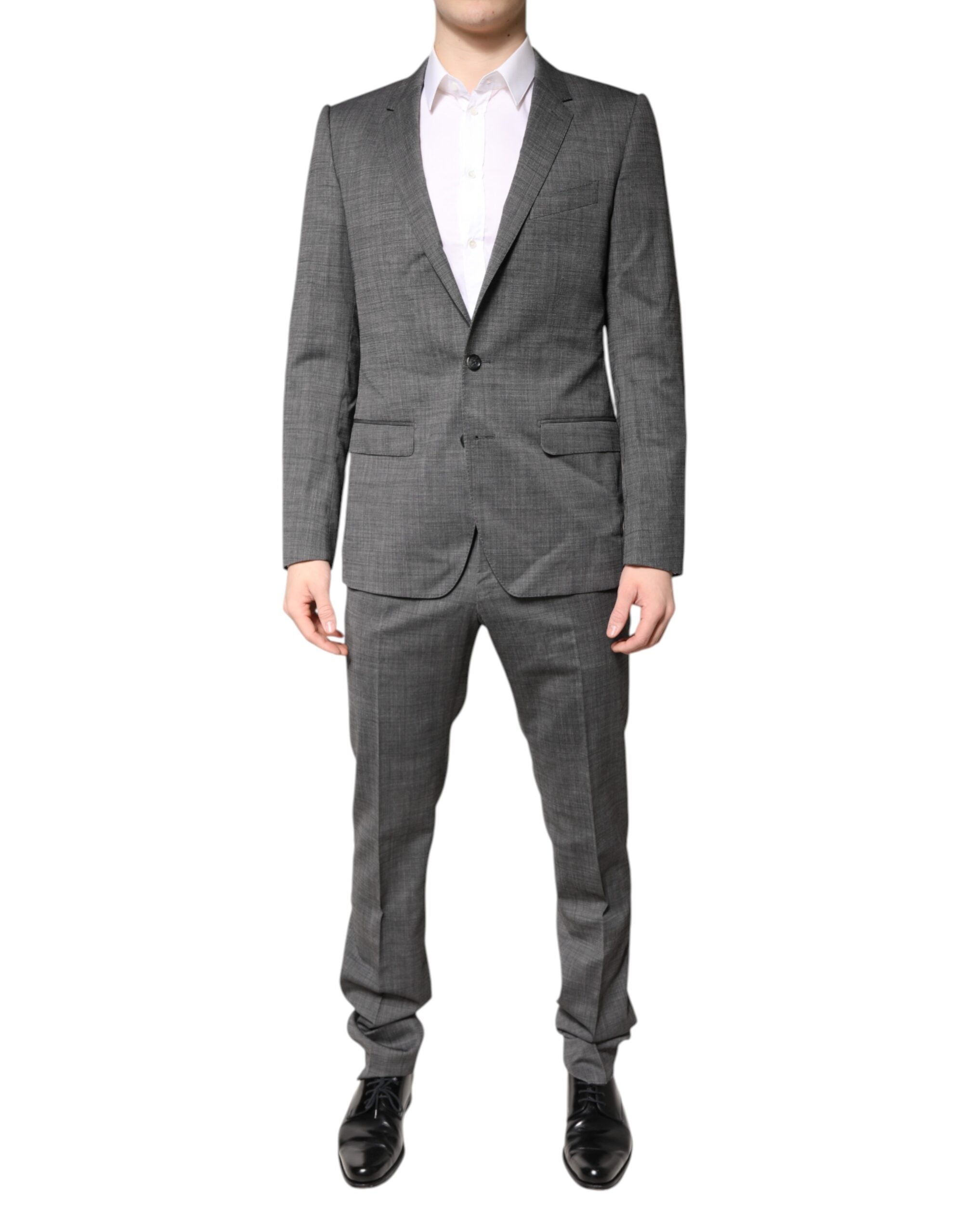 Costume en laine gris à deux boutons Dolce & Gabbana, costume deux pièces à revers simple et coupe élégante.