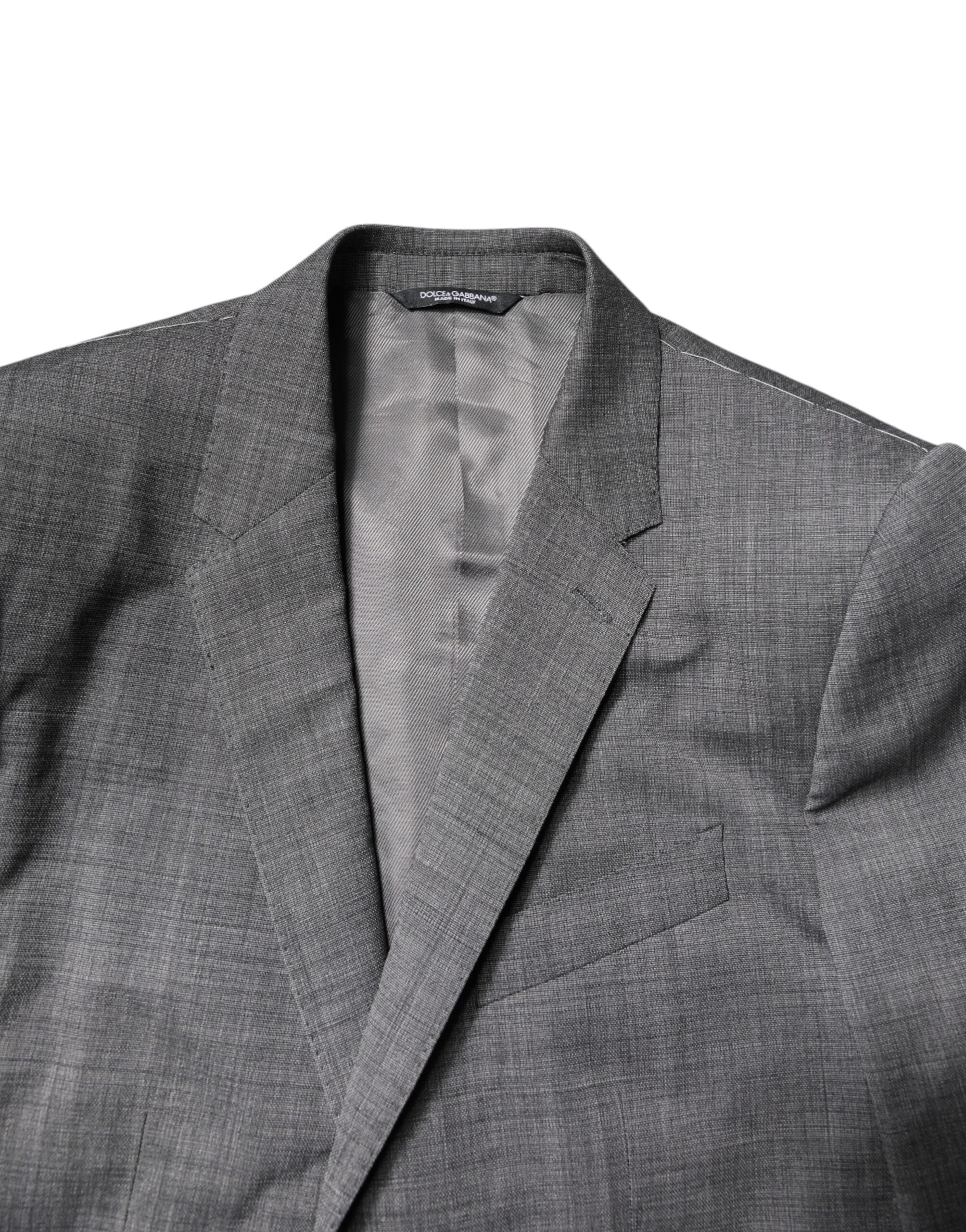 Costume deux pièces en laine grise Dolce & Gabbana, veste croisée à un bouton et pantalon assorti, élégant et classique.
