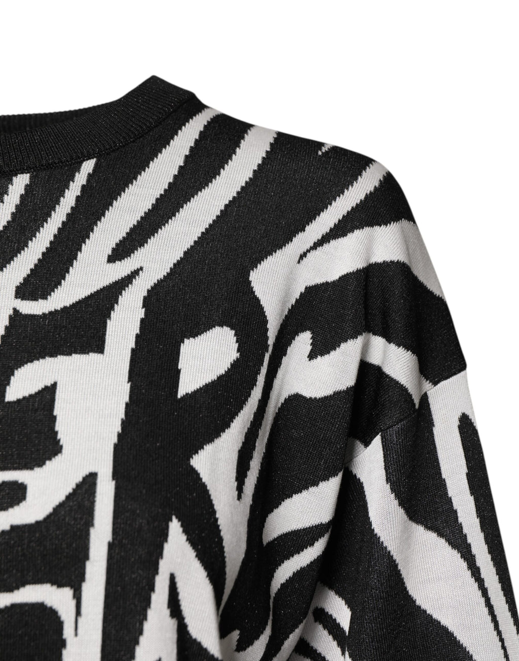 Pull-over femme Dolce & Gabbana à imprimé noir et blanc, sweat-shirt élégant avec design tendance visible sur l'image.