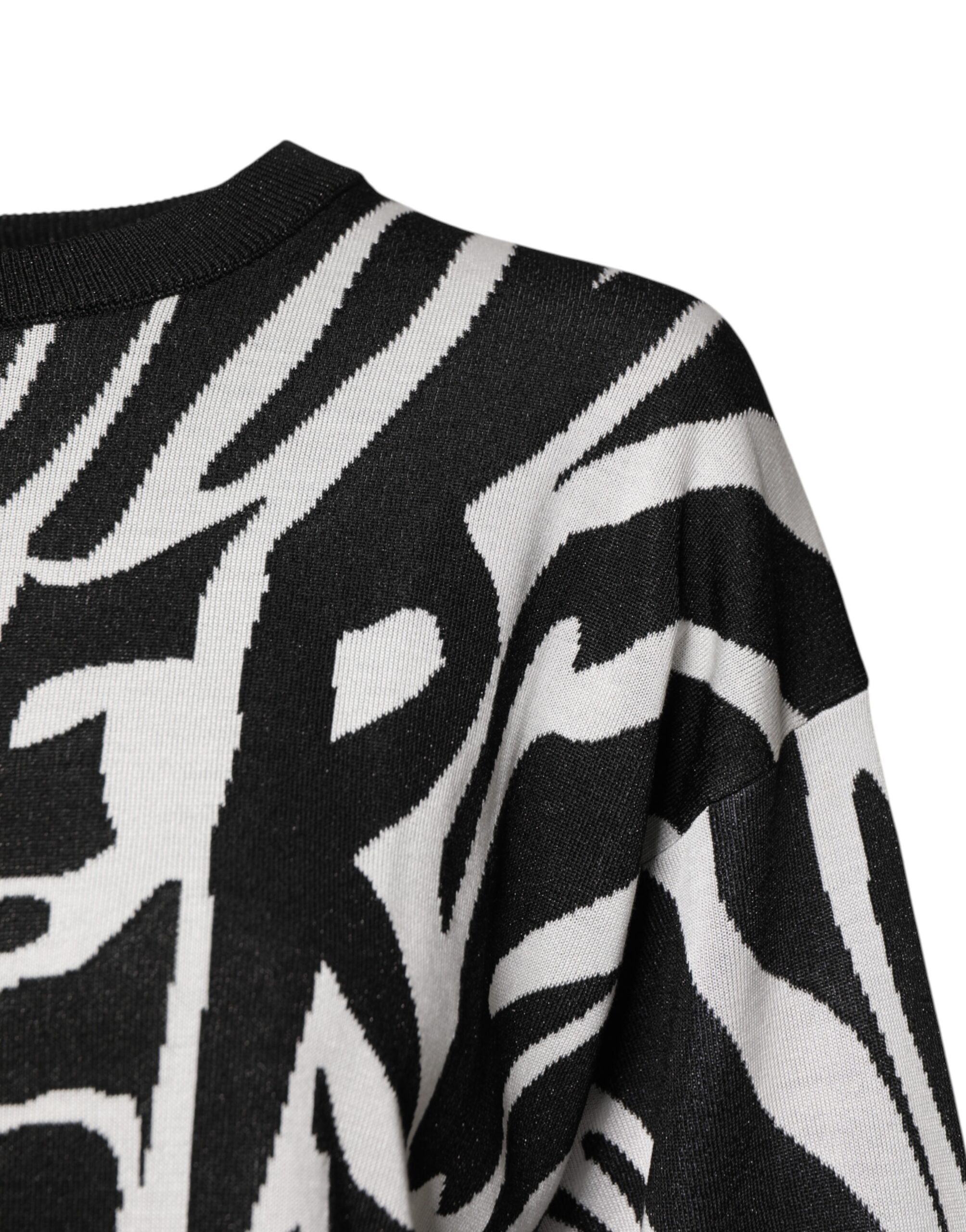 Pull-over femme Dolce & Gabbana à imprimé noir et blanc, sweat-shirt élégant avec design tendance visible sur l'image.