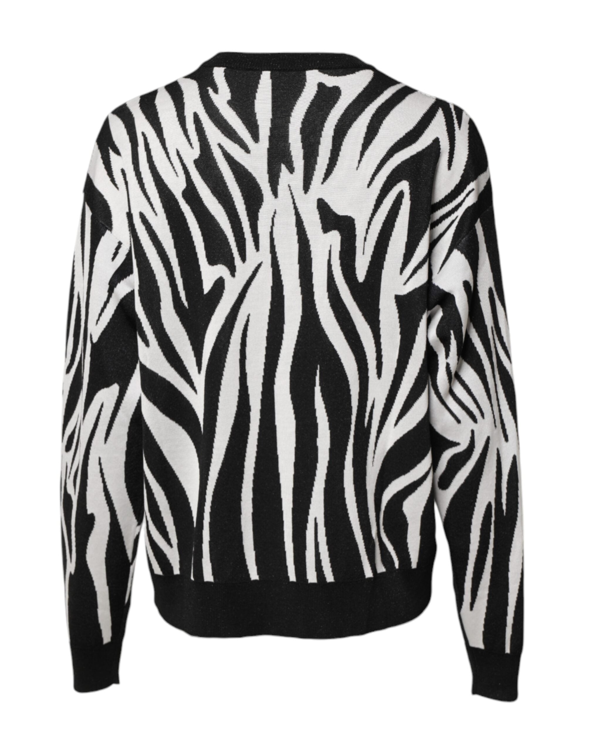 Pull-over femme Dolce & Gabbana noir et blanc à motif, pull en laine avec design élégant et moderne visible sur l'image.