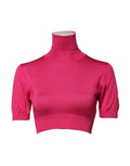 Pull court en soie rose Dolce & Gabbana à col roulé, tricoté, ajusté et tendance.