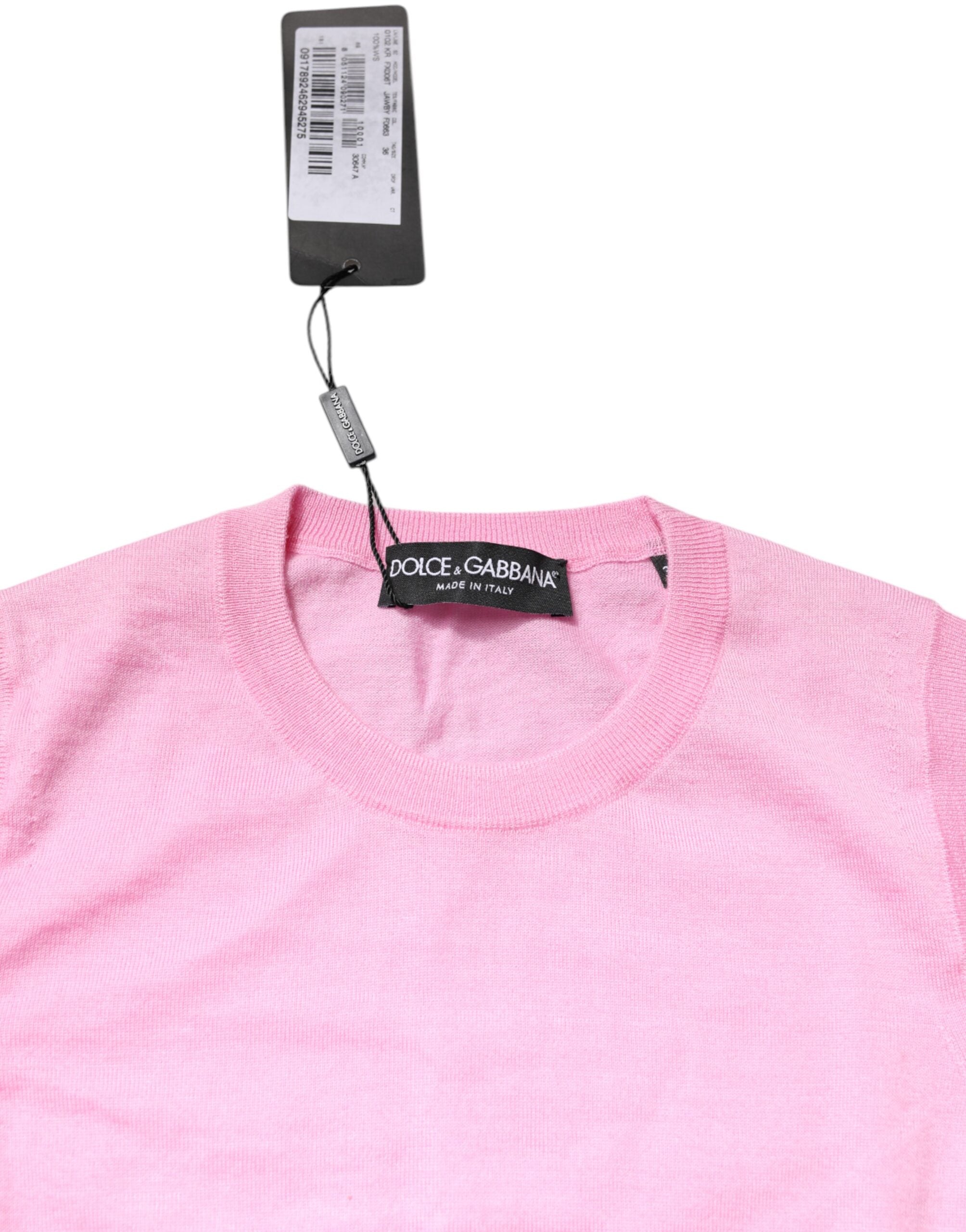 Débardeur en cachemire rose de Dolce & Gabbana avec col rond sans manches, tissu doux et élégant visible sur l'image.