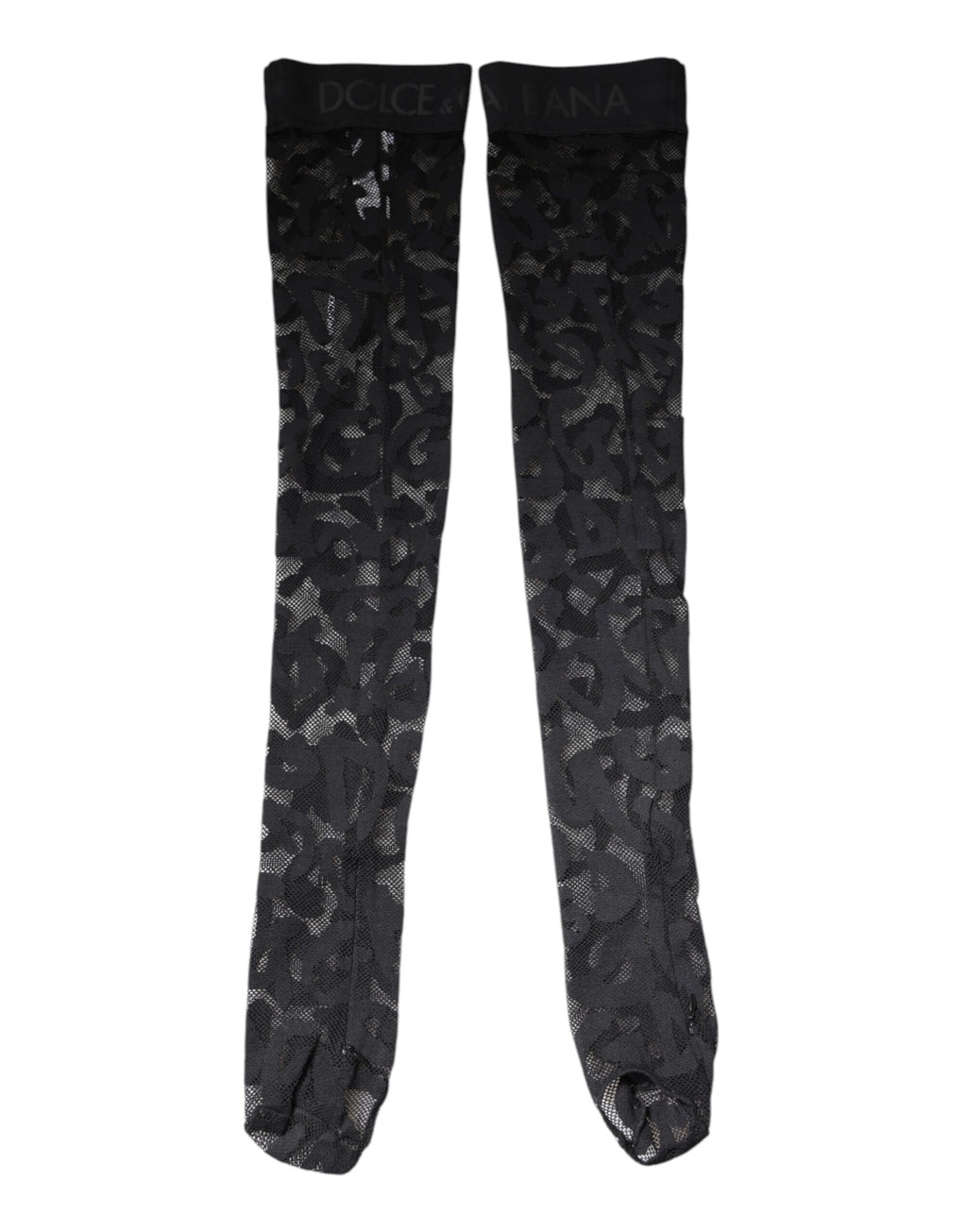 Chaussettes en dentelle florale noire en coton stretch de Dolce & Gabbana, visibles avec détails de finition élégante.