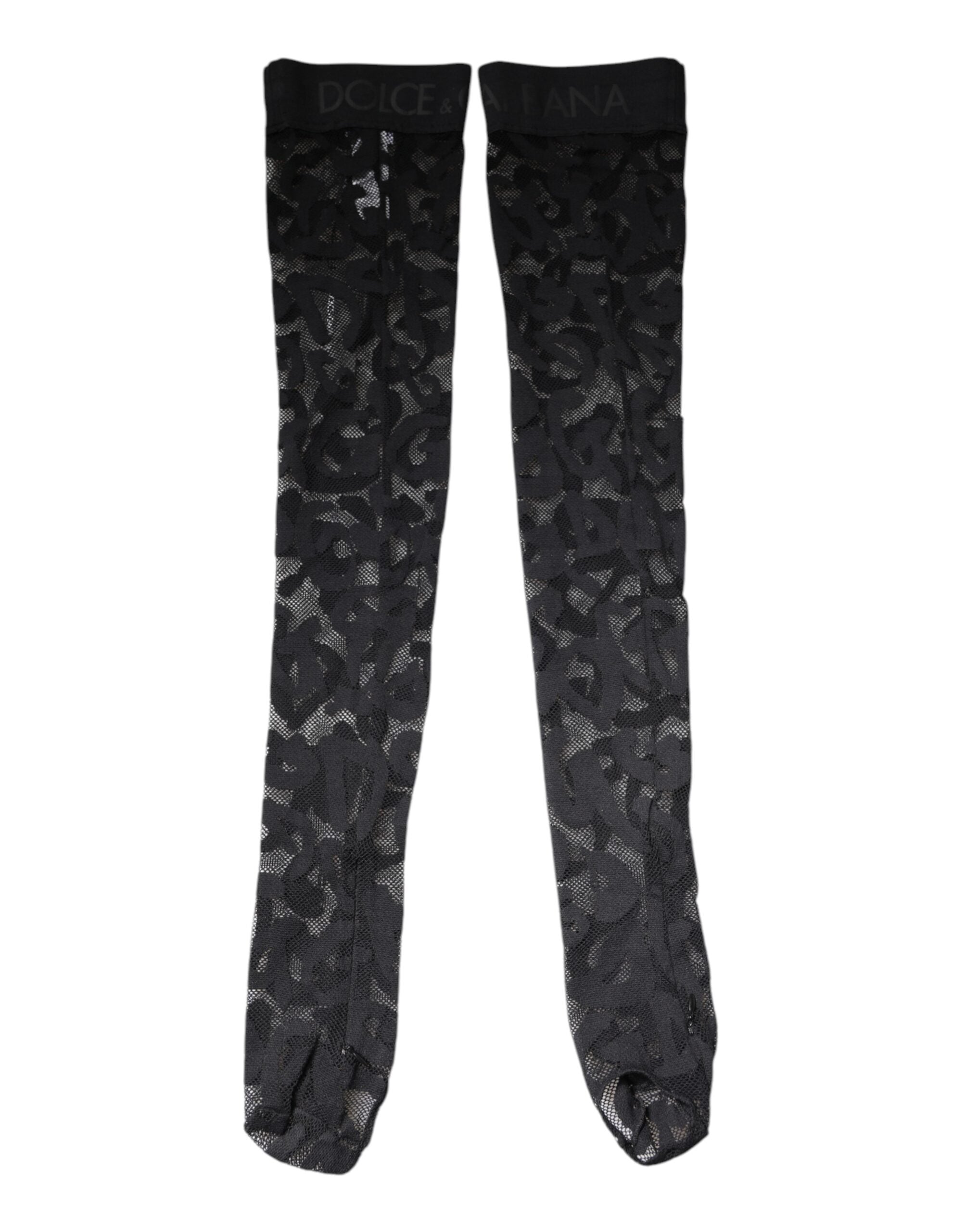 Chaussettes en dentelle florale noire en coton stretch de Dolce & Gabbana, visibles avec détails de finition élégante.