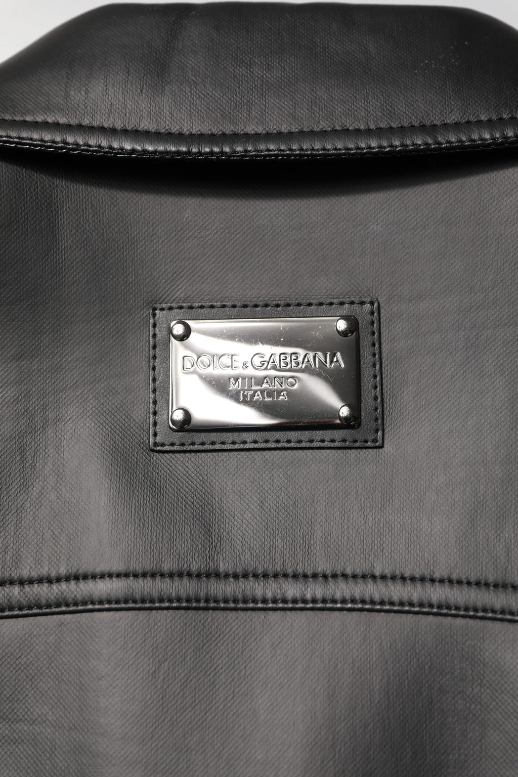 Veste en polyester noire Dolce & Gabbana style motard avec boutons, dentelle et design élégant pour un look tendance.