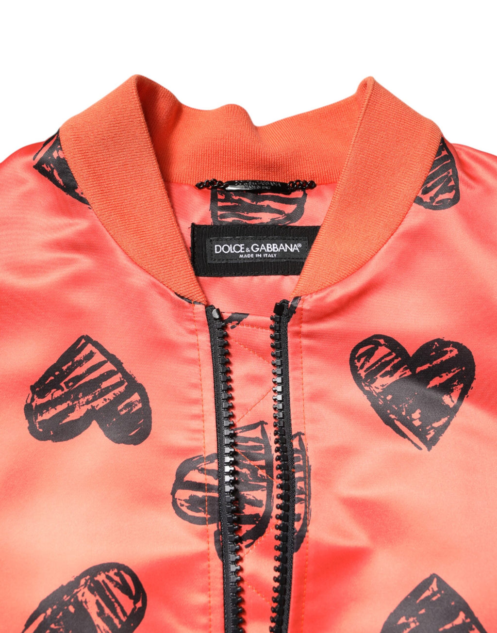 Veste bomber pour homme Dolce & Gabbana, orange avec fermeture éclair intégrale et motif cœur DG, style élégant et moderne.
