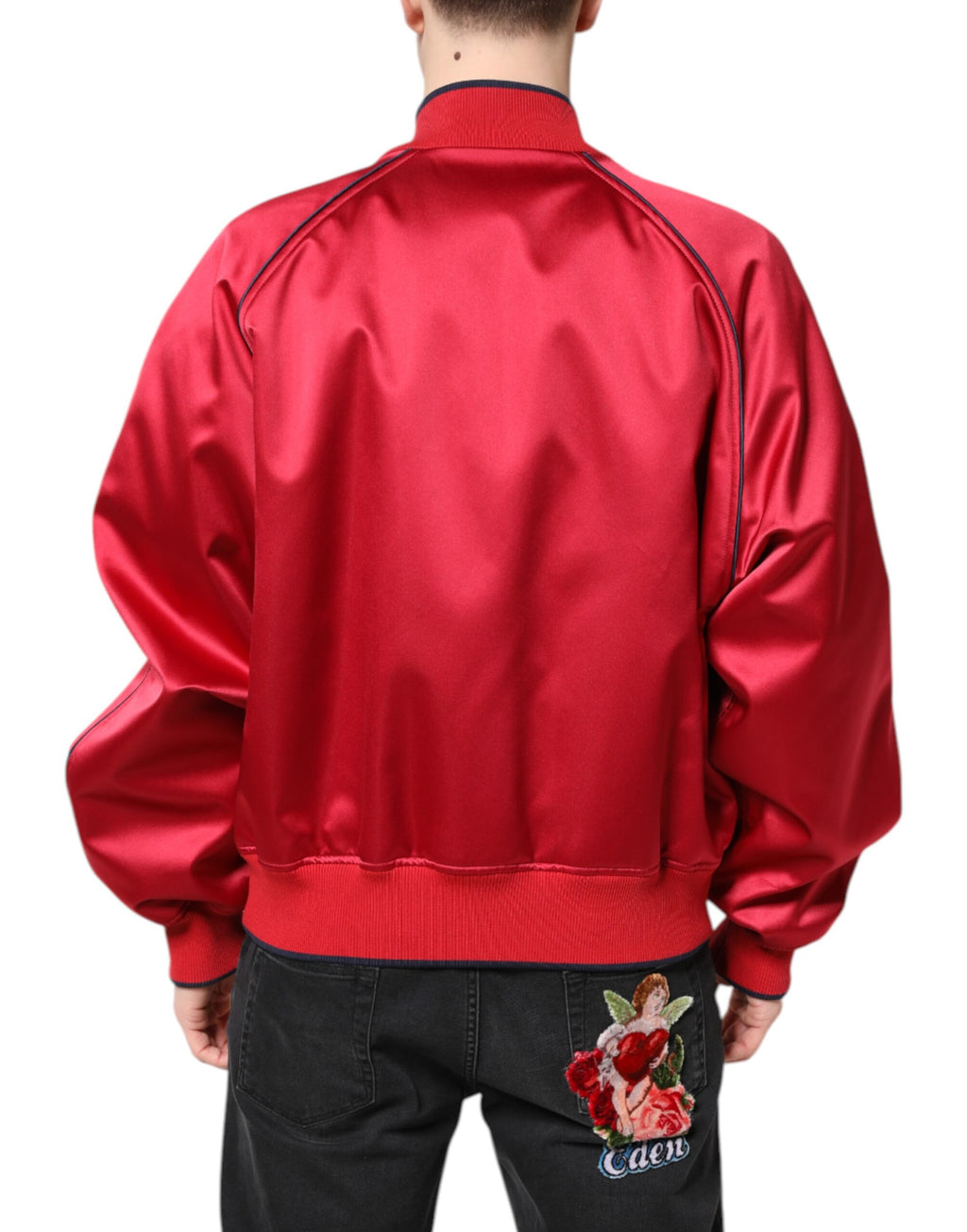 Veste bomber homme Dolce & Gabbana rouge avec patch floral, zip complet, style tendance et détails élégants.
