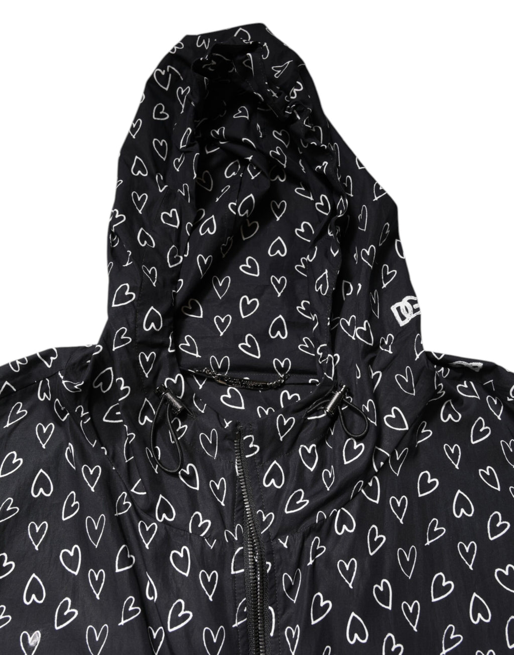 Veste coupe-vent noire Dolce & Gabbana avec motif cœur imprimé, capuche et style décontracté.