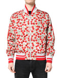 Veste bomber blanche Dolce & Gabbana avec motif cerise imprimée, fermeture éclair complète et style tendance.
