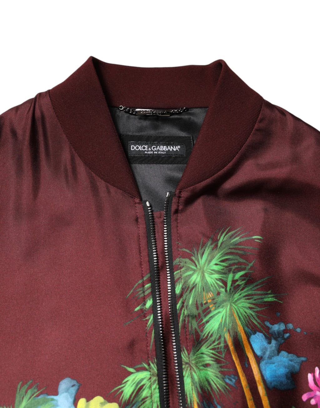 Veste bomber zippée Dolce & Gabbana avec imprimé floral bordeaux, style élégant et tendance.