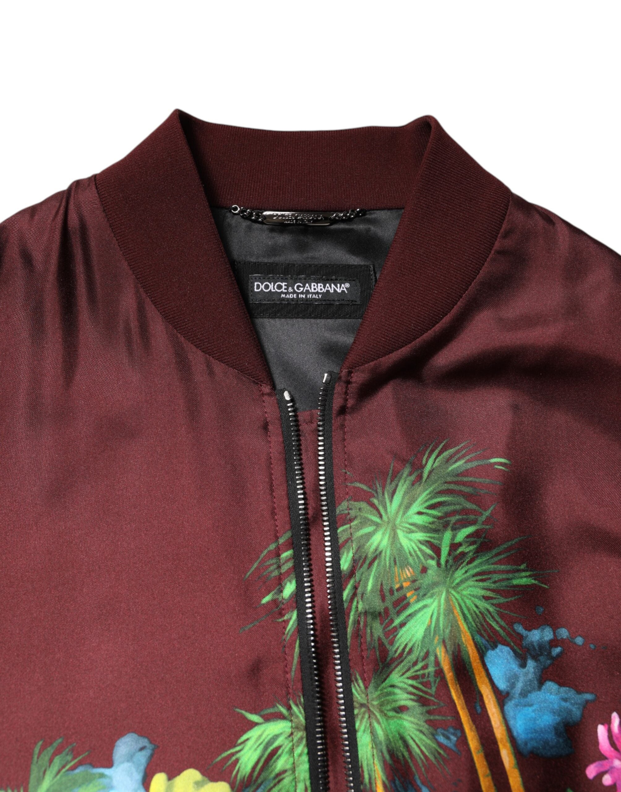 Veste bomber zippée Dolce & Gabbana avec imprimé floral bordeaux, style élégant et tendance.