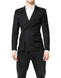 Manteau blazer noir Dolce & Gabbana MARTINI à double boutonnage, élégante coupe classique, porté avec col et poches visibles.