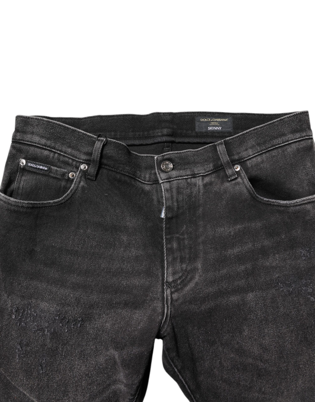Jeans skinny en denim gris délavé de Dolce & Gabbana, en coton, visibles sur l'image avec détails de couture et coupe ajustée.