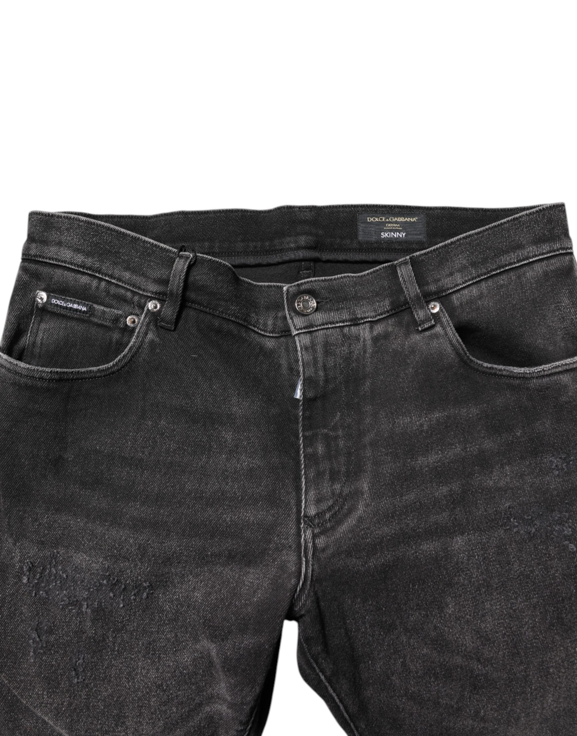 Jeans skinny en denim gris délavé de Dolce & Gabbana, en coton, visibles sur l'image avec détails de couture et coupe ajustée.