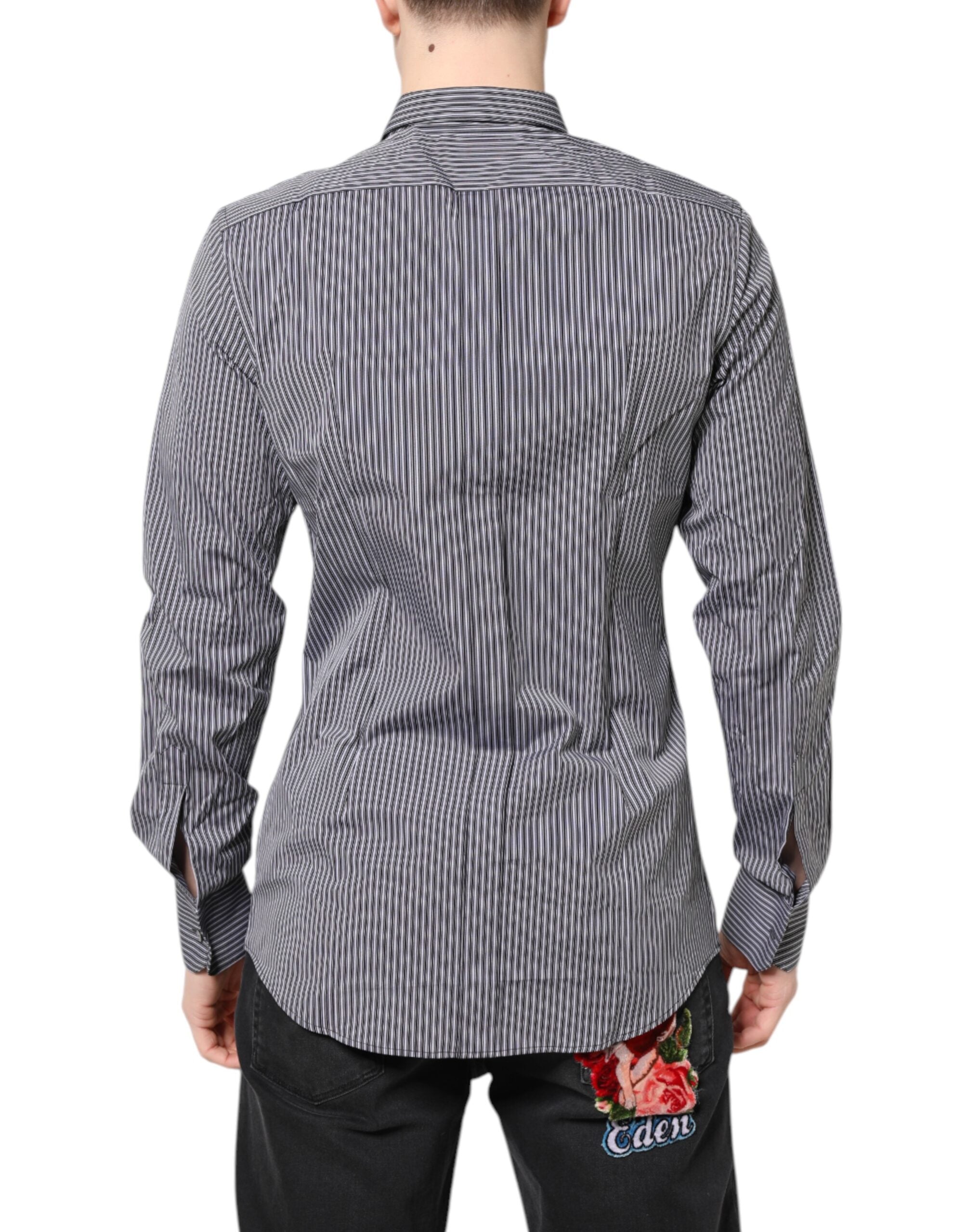 Chemise de costume Dolce & Gabbana à rayures noires, blanches et détails dorés, style élégant et formel.