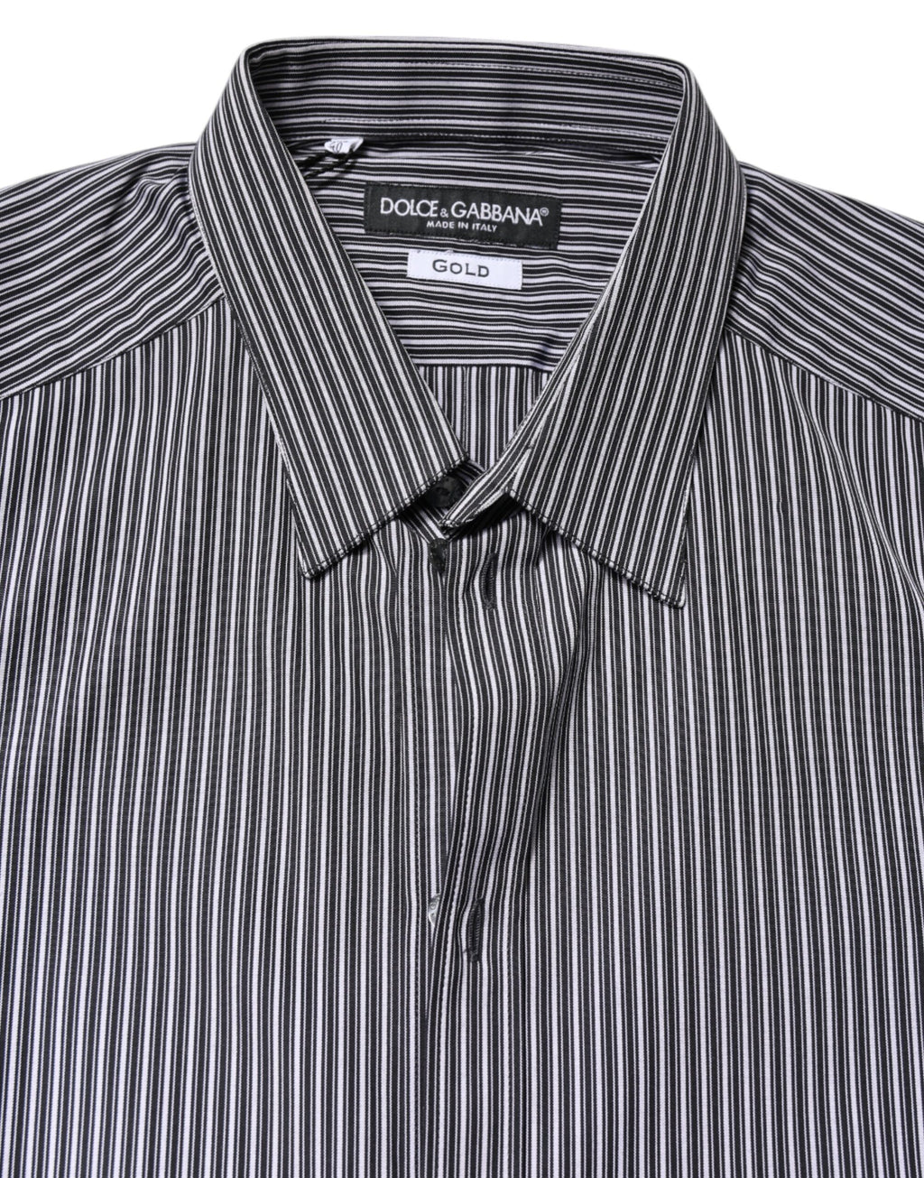 Chemise formelle Dolce & Gabbana à rayures noires et blanches avec détails dorés, vue de face.