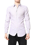 Chemise en coton blanc à rayures dorées de Dolce & Gabbana, manches longues élégantes et détails sophistiqués.